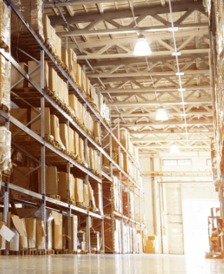 Pallets stacked on shelves in a warehouse